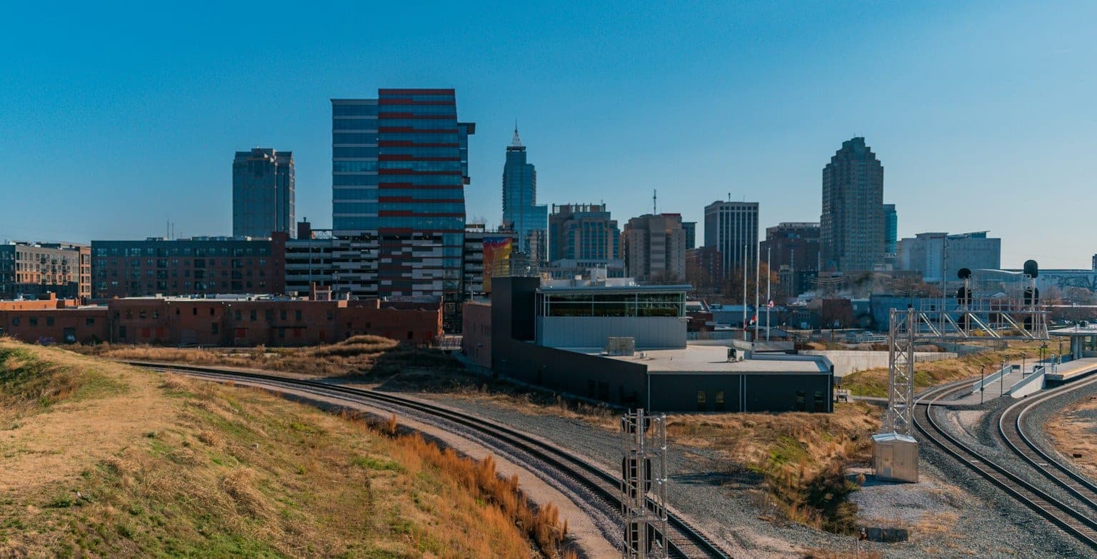 Downtown Raleigh skyline on a clear day, seen from the Boylan Bridge